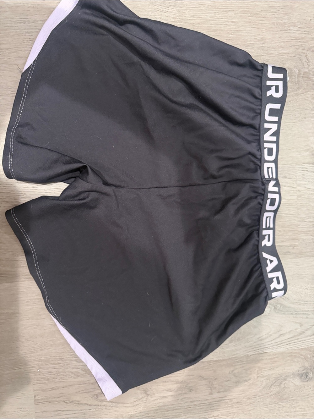 Under Armour woman’s  Black Shorts with Light Purple Trim and Logo - Picture 2 of 3